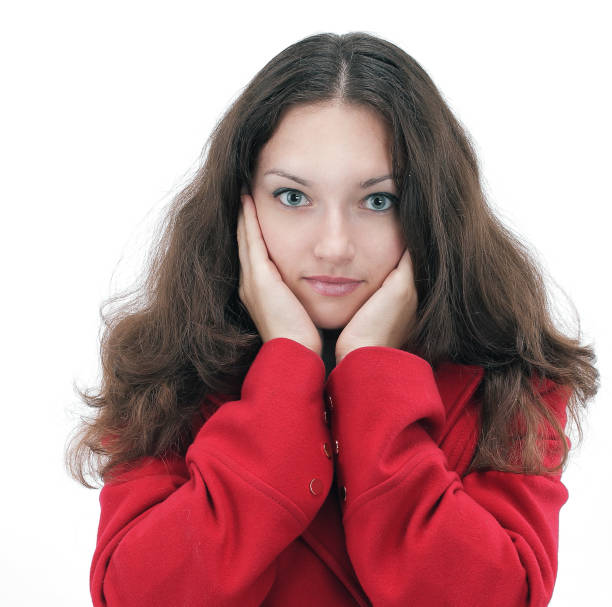 istock surprised young woman in a red coat 927727450