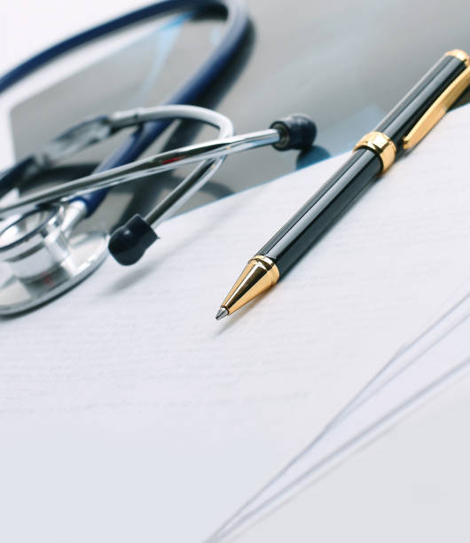 istock stethoscope,x-ray and pen on the table 927727514