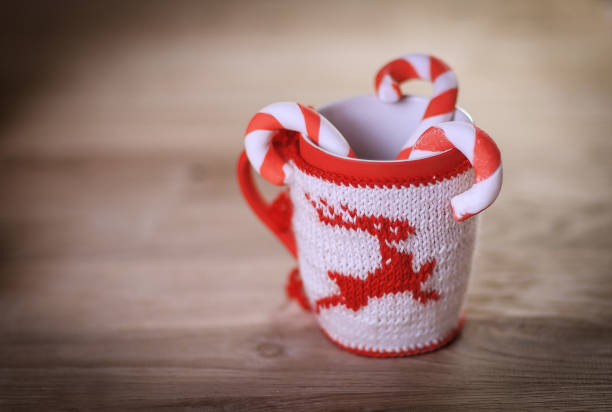 istock Christmas mug and candle on wooden background 927730744