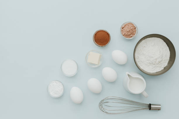 istock Flat lay Ingredients background: fresh eggs for baking on pastel background, top view, copy-space 927734832