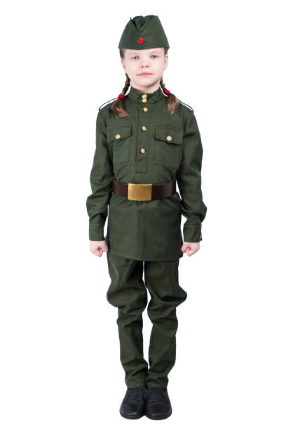 istock girl in military uniform is standing, isolated on white 927738184