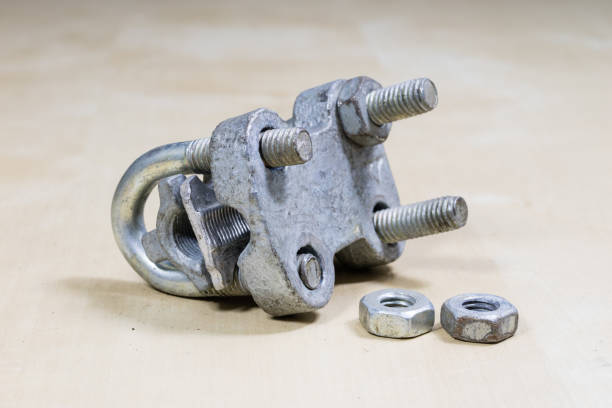 istock Old garden accessories. Rusty hose clamps on the workshop table. Light background. 927740830