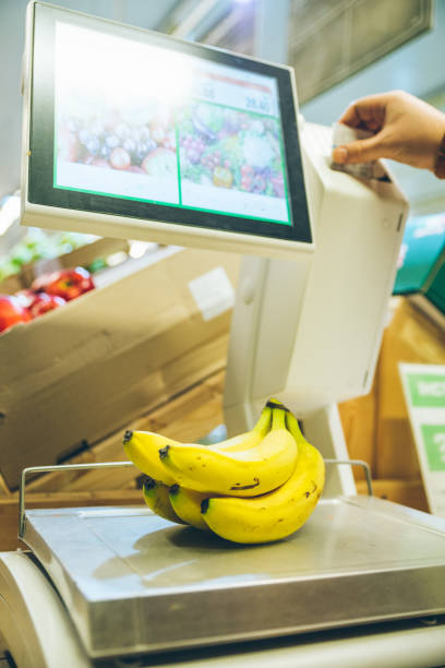istock man weigh fruits on digital scales 927743768
