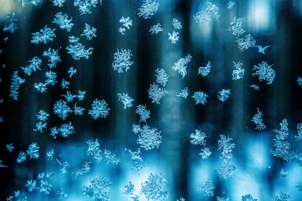 istock Frozen snowflakes in winter on the glass 927747664