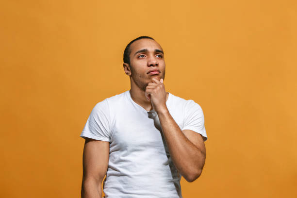 istock Young serious thoughtful businessman. Doubt concept 927752692