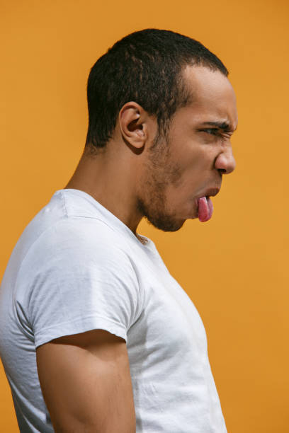 istock Crazy Afro-American man is looking funny against orange background 927752816
