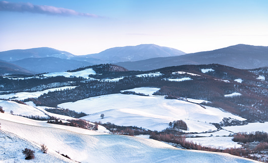 Snow in Tuscany. Winter panorama view at sunset. Siena, Italy