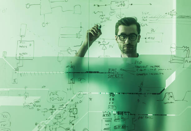 istock Young engineer drawing a business ideas on a glass in the office. 927757472