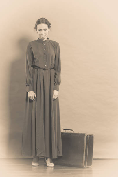 istock Woman retro style with old suitcase 927761188
