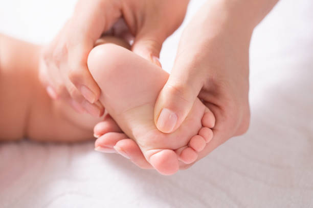 istock Mother take a Baby Exercise for Relief from Baby Constipation, Selective focus 927764876