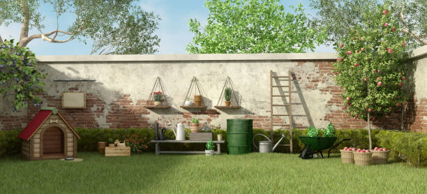 istock Garden with dog house and gardening tools 927771002