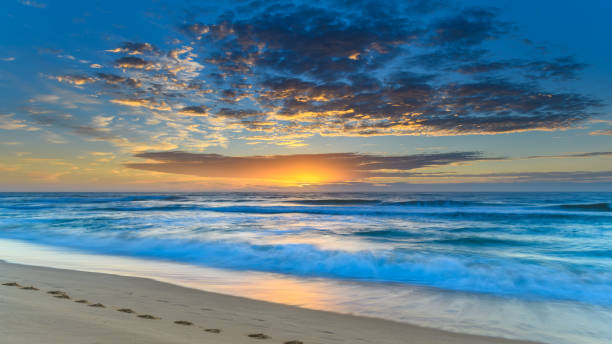 istock Vibrant Sunrise Seascape with Clouds 927771068