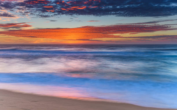 istock Vibrant Sunrise Seascape with Clouds 927771132