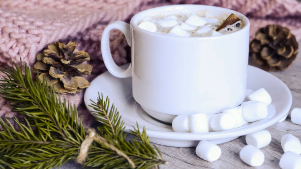 istock Coffee with marshmallows at the Christmas tree. Festive warming 927772342