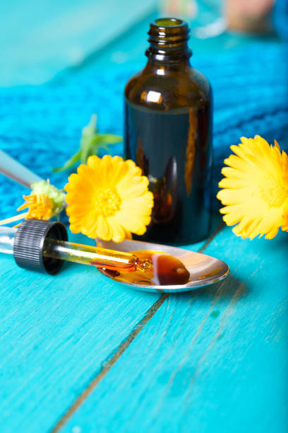 istock Calendula tincture for mouth rinsing. 927775482