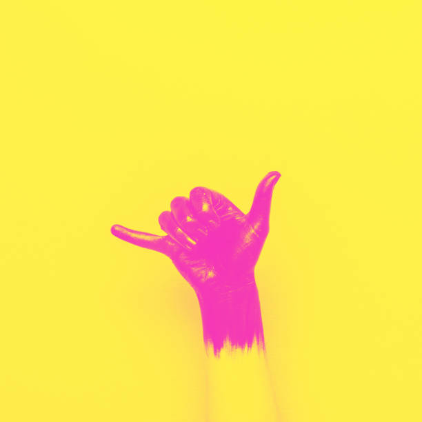 surf Shaka gesture surf Shaka gesture by black painted hand on pink background. minimal style of summer. yellow and pink double color effect pop art photos stock pictures, royalty-free photos & images