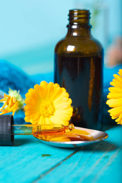 istock Calendula tincture for mouth rinsing. 927775866
