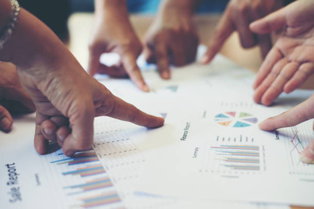 istock Group of business partners discussing ideas analysis and planning work in office. 927776190