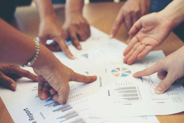 istock Group of business partners discussing ideas analysis and planning work in office. 927780202