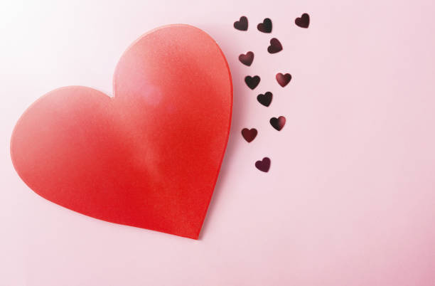 istock Big red paper heart with little shiny hearts 927780562