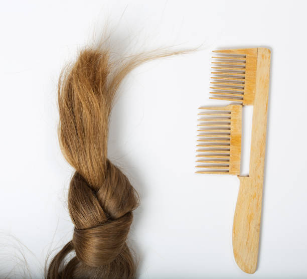 istock Hair and a broken hair brush. 927785242