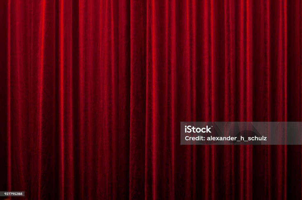 red curtain close-up of a closed red velvet curtain in theater Curtain Stock Photo
