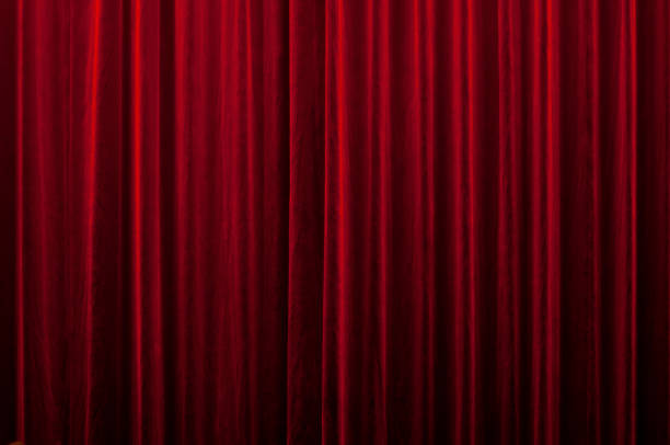 red curtain close-up of a closed red velvet curtain in theater stage theater photos stock pictures, royalty-free photos & images