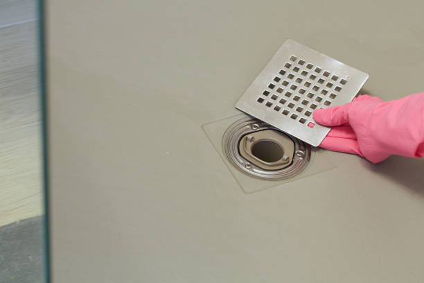 istock Shower drain box grate on a shower base. Body part. 927798030
