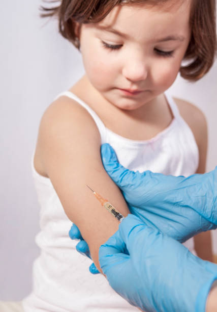 istock Nurse vaccinating 3 years old little girl 927798752
