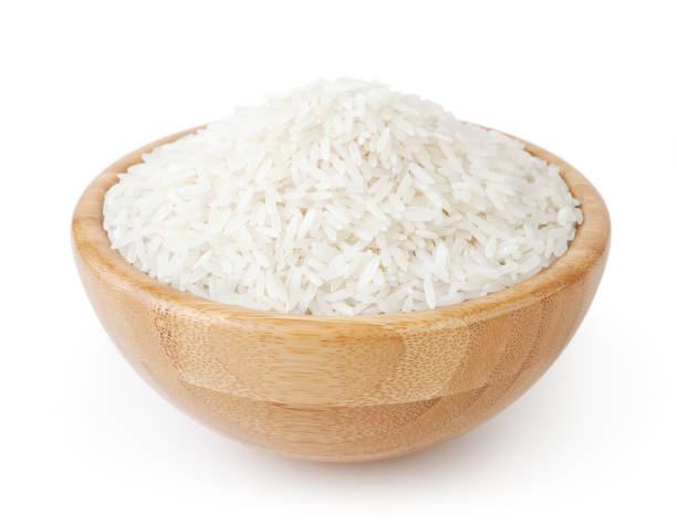 istock White long-grain rice in wooden bowl isolated on white background 927802702