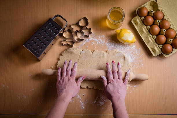 istock Woman rolling dough for Christmas cookies 927802822