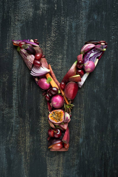 istock Vegetables and fruit forming alphabet letters in purple hues 927806112