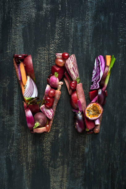 istock Vegetables and fruit forming alphabet letters in purple hues 927806118