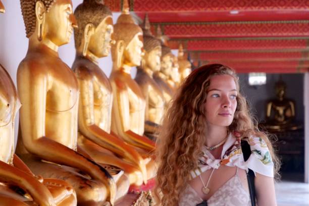 istock Young tourist woman visiting temple 927809780
