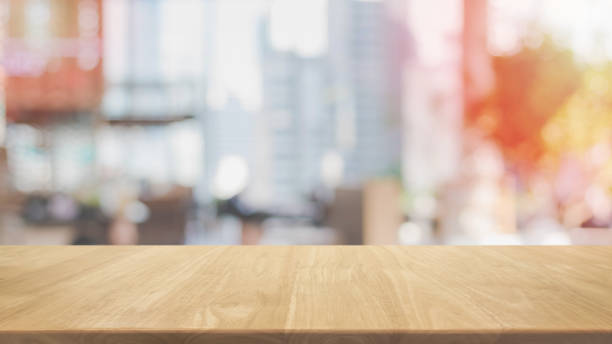 istock Empty wood table top and blurred restaurant interior background - can used for display or montage your products. 927809994