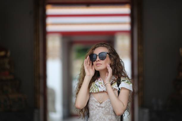 istock Young tourist woman at temple 927810012