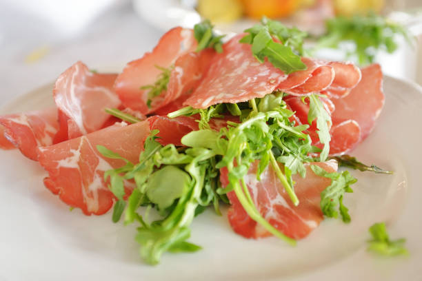 istock Tyrolean bacon slices and arugula in a dish 927810422