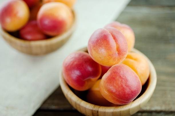 istock Tasty peaches fresh fruit in a bowl 927813156