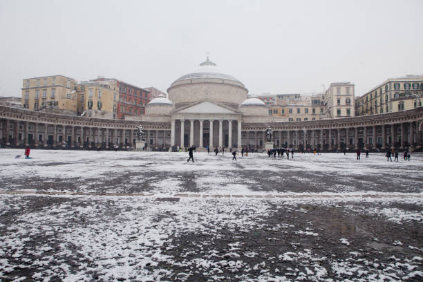 Naples Square, Piazza Plebiscito, with Snow Naples, Italy - Feb 27, 2018: Main square in the city of Naples called "piazza Plebiscito" with snow and people walking around and playing with snow. Photo taken at morning during a very unusual event like this snowfall. Latest snowfall in Piazza Plebiscito was in 1956. piazza plebiscito stock pictures, royalty-free photos & images