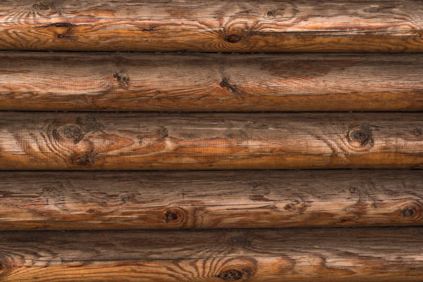 istock Beautiful wooden background - old brown horizontal logs close-up 927821034