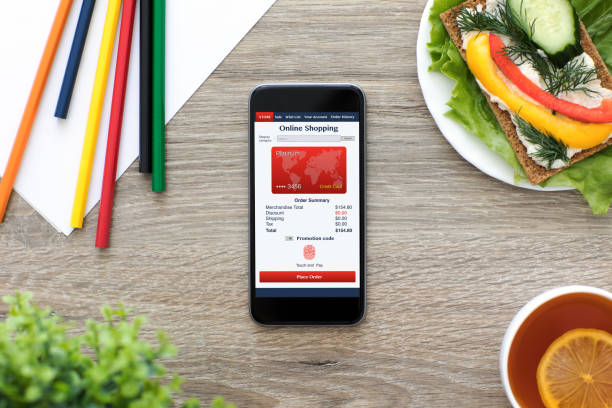 istock Phone with app online shopping on screen in cafe 927821218