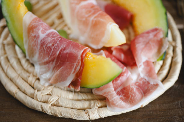 istock Cantaloupe melon and italian ham slices 927822184