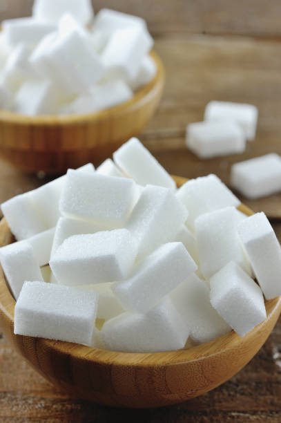 istock Sugar cubes in a wooden bowl 927825116