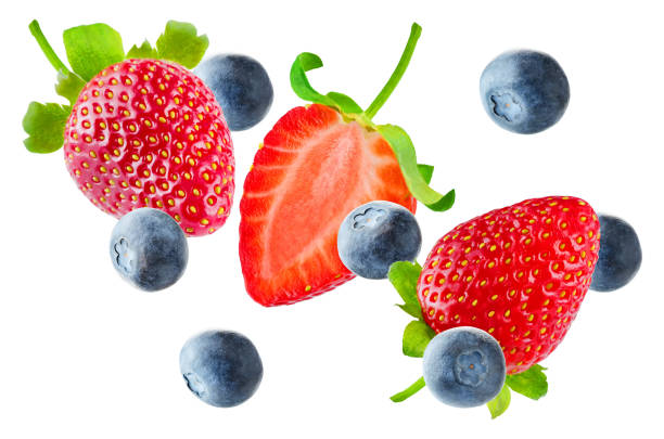 istock Fresh flying strawberries and blueberries isolated 927825854