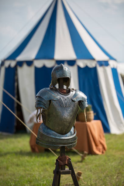 istock Medieval Metallic Armor and Ancient Tent in background 927826264