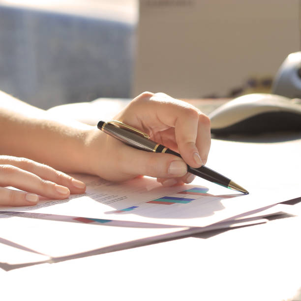 istock Business Woman Writing with pen 927826876