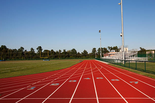 Track And Football Field Venue at Hgh School Clear Day stock photo