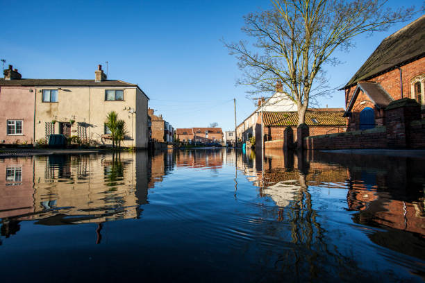 Flooded village Small Yorkshire village in the UK flooded. Images show how the flood water engulfed the community flood plain photos stock pictures, royalty-free photos & images