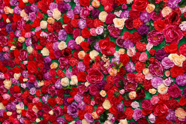 istock Background of multi-colored roses and other flowers 927840544