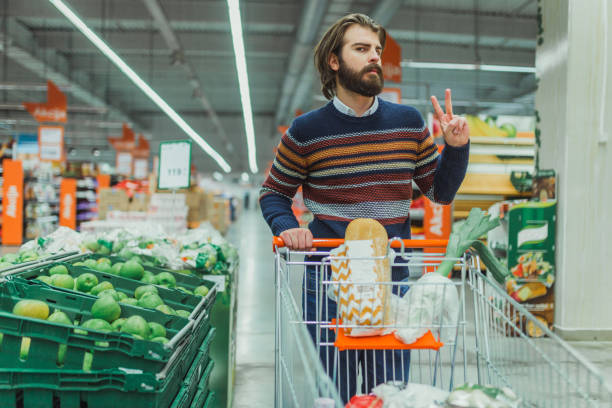 istock Handsome bearded man shopping in the supermarket 927852564